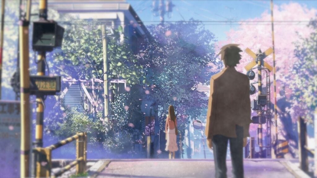 Takaki and Akari stood at opposite ends of a railroad crossing as sakura flowers fall around them