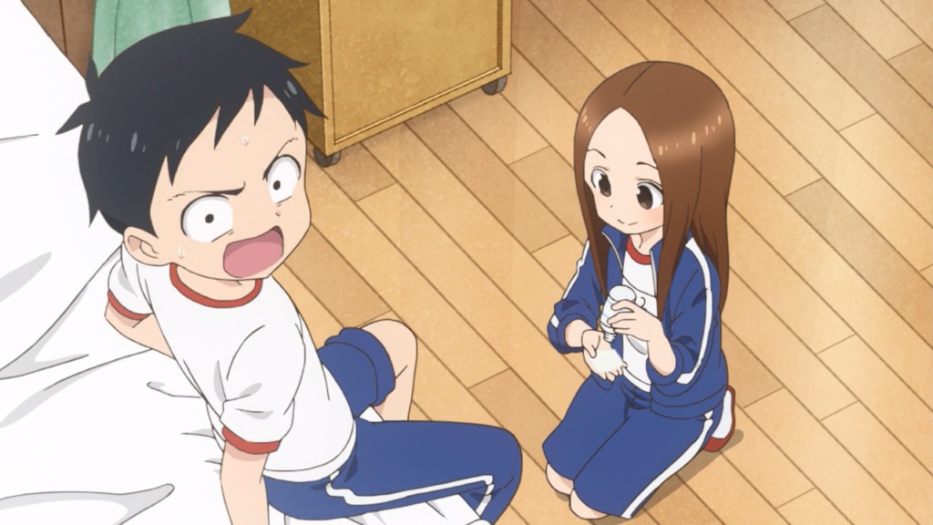 Takagi attempting to clean Nishikata's injury