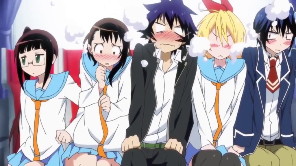 Ruri pushing Onodera towards Raku who is sat next to Chitoge and Tsugumi on a bus. All are blushing. 