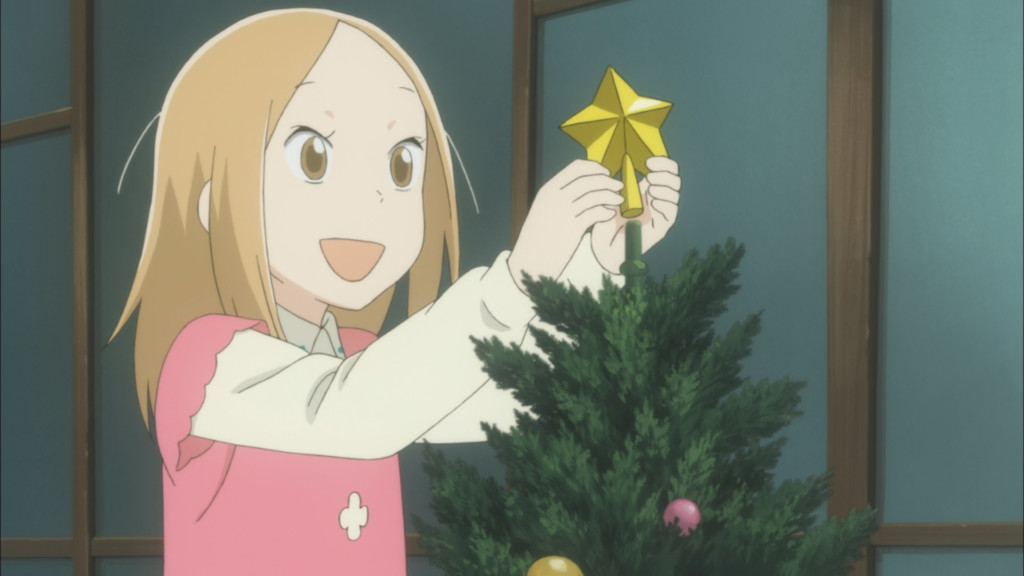 Usagi Drop's Rin putting a star on top of a Christmas tree during Christmas anime episode of Usagi Drop