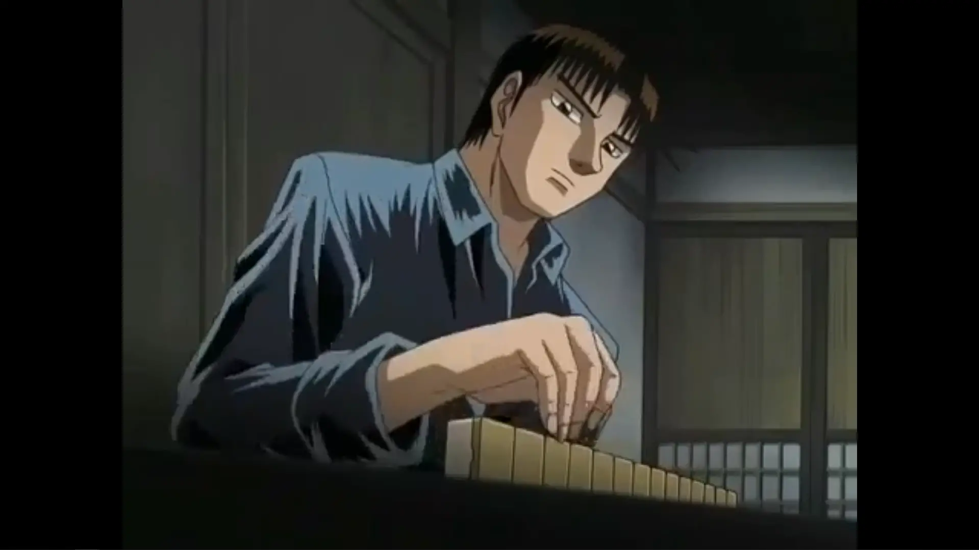 Tetsuya carefully choose his next mahjong tile in a dark old room.