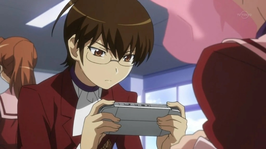 anime boy playing handheld video game